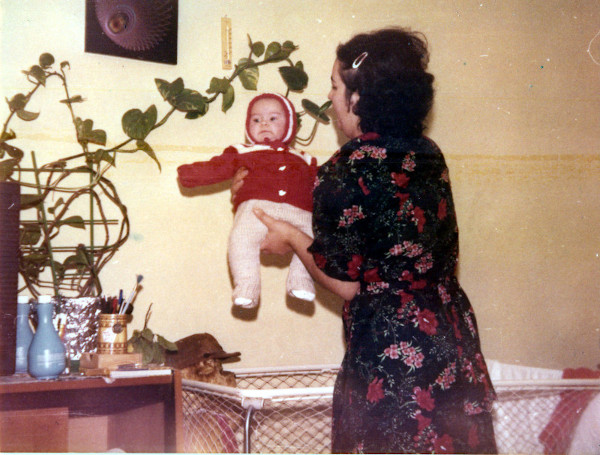 My mom and me with string art in the background